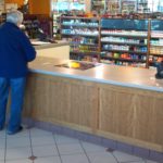 in-store sales transaction counter and tobacco cabinets